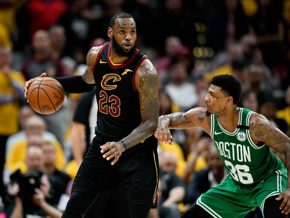 Cleveland Cavaliers forward LeBron James (23) drives to the basket against Boston Celtics guard Marcus Smart (36) during the forth quarter in game four of the Eastern conference finals of the 2018 NBA Playoffs at Quicken Loans Arena. David Richard
