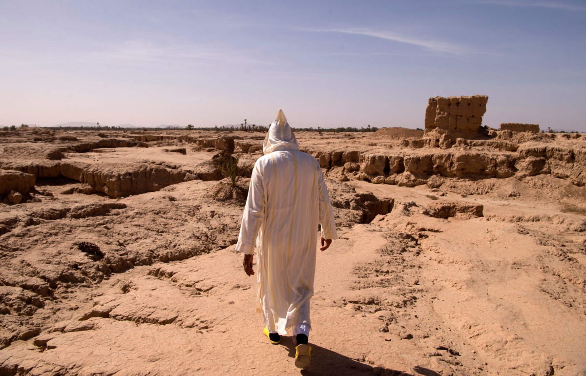 REPRESENTATIVE IMAGE: A man walking through a dried out area that used to be part of the Tafilalet oasis near  southeastern oasis town of Erfoud of Morocco north of Er-Rissani in the Sahara Desert, Oct 27, 2016. AFP / Fadel Senna