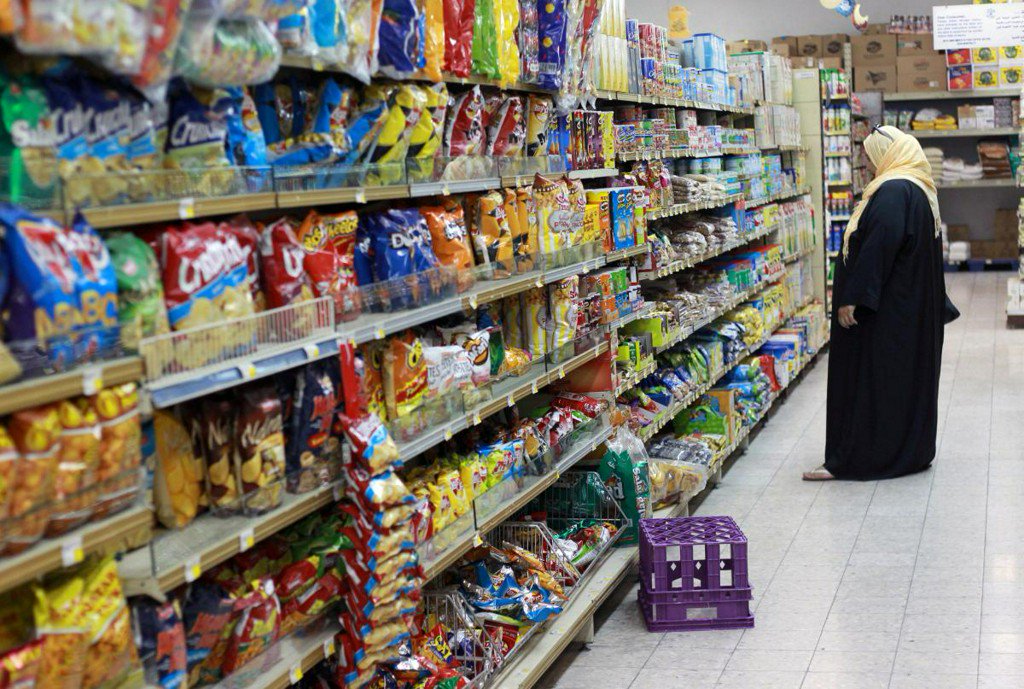 FILE PHOTO: A woman shops in a supermarket in Doha, Qatar June 7, 2017. REUTERS/Stringer