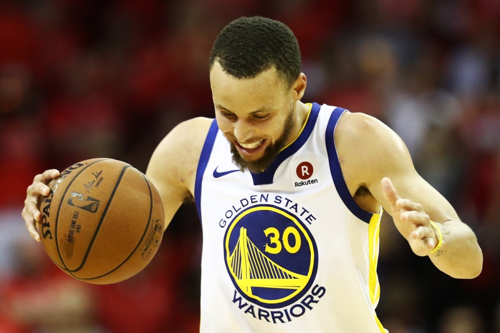 Stephen Curry #30 of the Golden State Warriors reacts in the fourth quarter of Game Seven of the Western Conference Finals of the 2018 NBA Playoffs against the Houston Rockets at Toyota Center on May 28, 2018 in Houston, Texas. Ronald Martinez/Getty Image