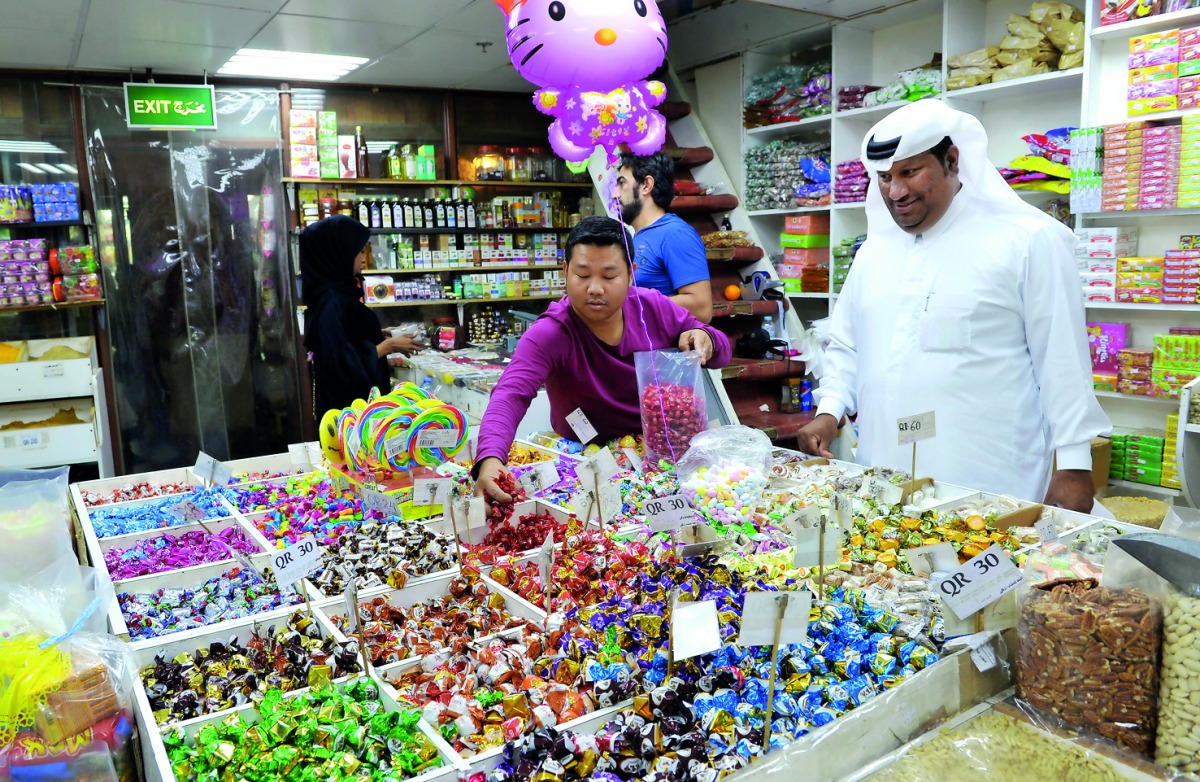 Shoppers buying sweets at a shop in Souq Waqif. Pic: Salim Matramkot/The Peninsula