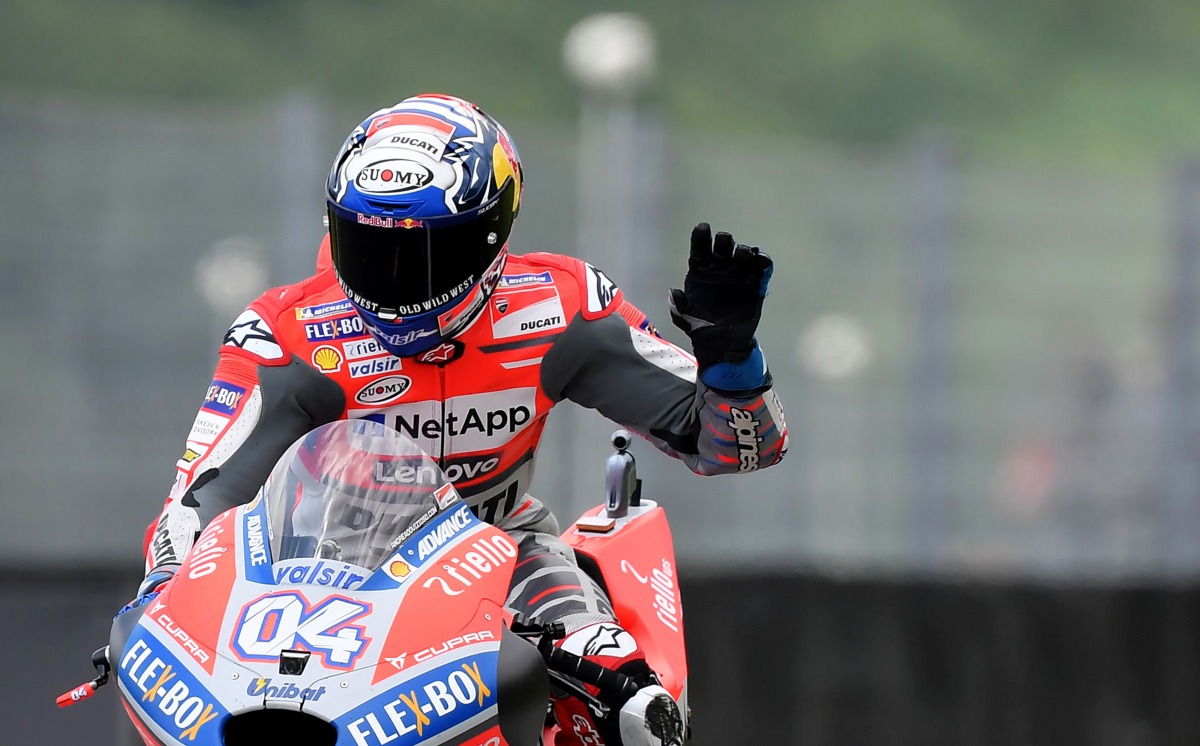 Ducati Team's Italian Andrea Dovizioso waves during a free practice session ahead of the Italian Moto GP Grand Prix at the Mugello racetrack in Scarperia e San Piero, on June 1, 2018. AFP / Tiziana Fabi 