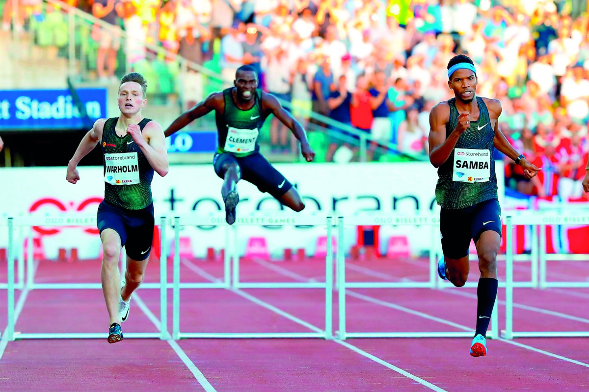 Qatar’s Abderrahman Samba (right), Norway’s Karsten Warholm (left) and USA’s Kerron Clement compete in the men’s 400m hurdles event during the Oslo IAAF Diamond League meet yesterday.