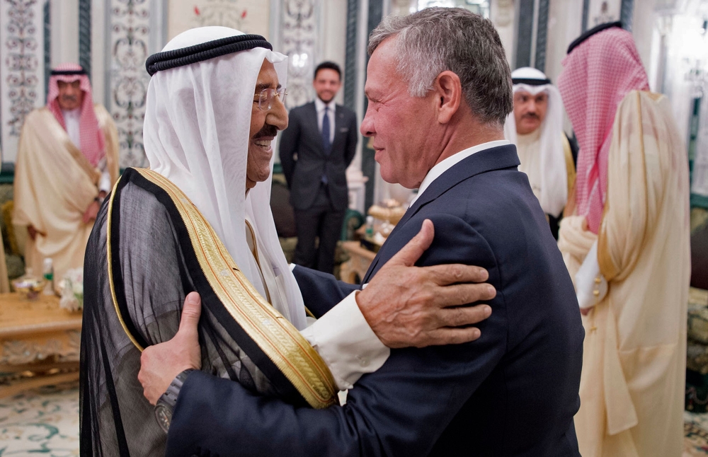 This handout picture released by the Saudi Royal Palace on June 11, 2018, shows Jordanian King Abdullah II and Kuwait Emir Sheikh Sabah al-Ahmad al-Jaber al-Sabah (L) attending a meeting in Mecca to discuss the economic crisis in Jordan. AFP PHOTO / SAUDI