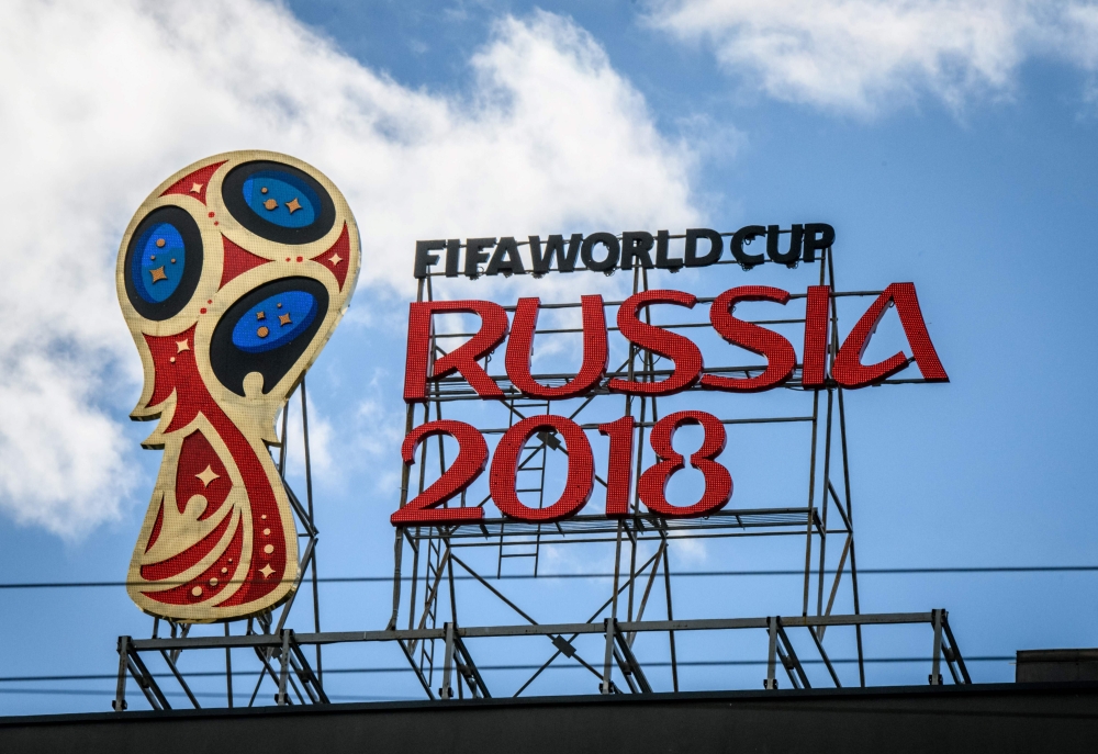 A picture taken on June 6, 2018 shows the 2018 FIFA World Cup logo on top of a building in Moscow. / AFP / Mladen ANTONOV
