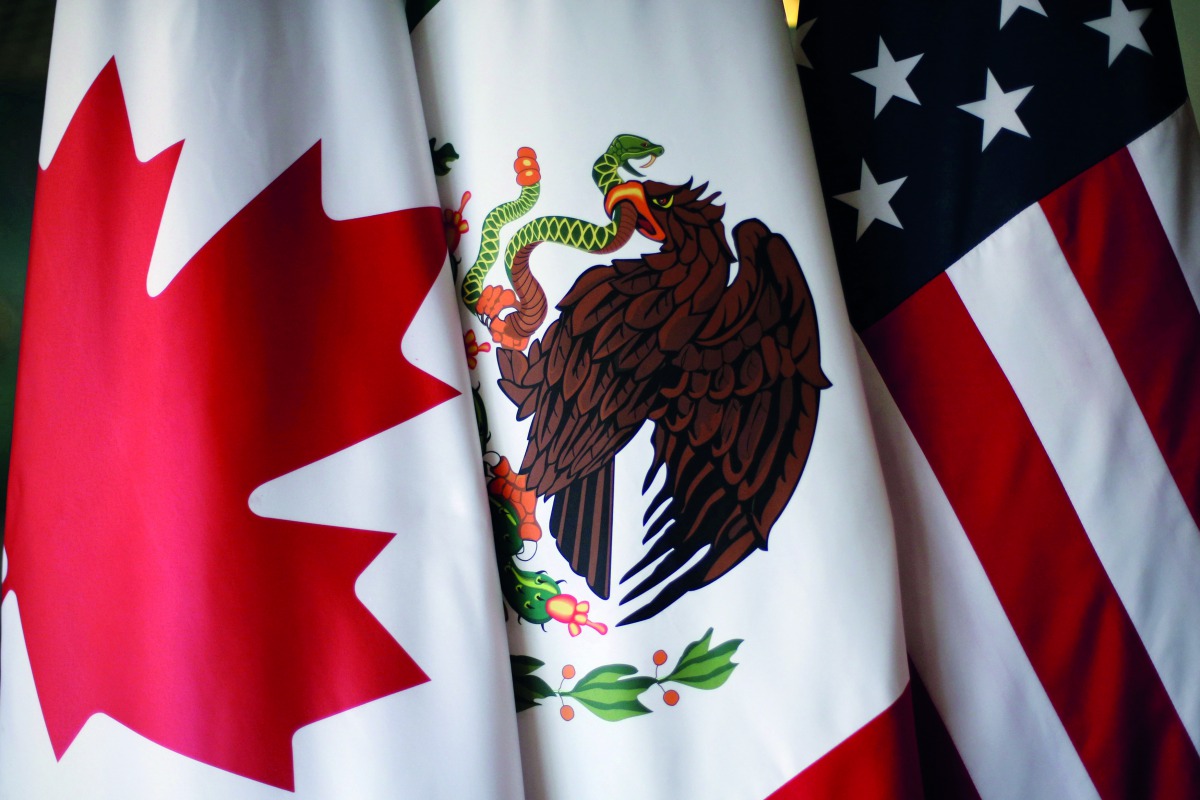 FILE PHOTO: Flags are pictured during NAFTA talks involving the United States, Mexico and Canada, in Mexico City, Mexico, November 19, 2017. Reuters/Edgard Garrido