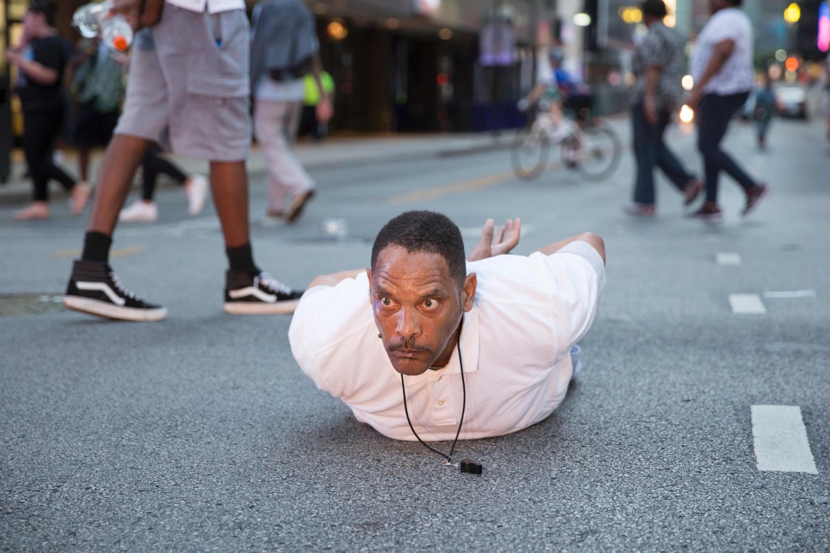 A man lays on the ground after yelling 'Don't shoot me' at police during a rally in Dallas, Texas on July 7, 2016 to protest the deaths of Alton Sterling and Philando Castile (AFP) 