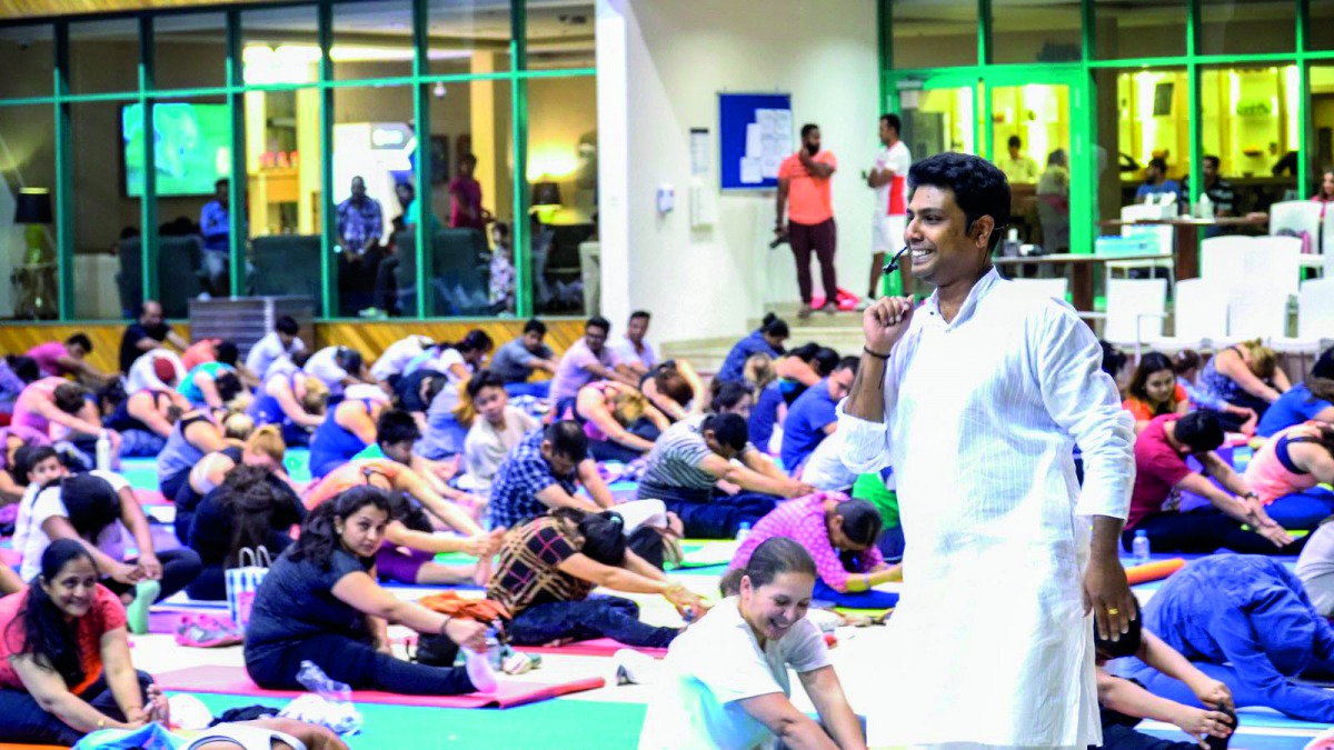 Vishnu Prasad, a Yoga instructor, train people to do Yoga at Sheraton Grand Hotel Doha to mark the International Yoga Day. 