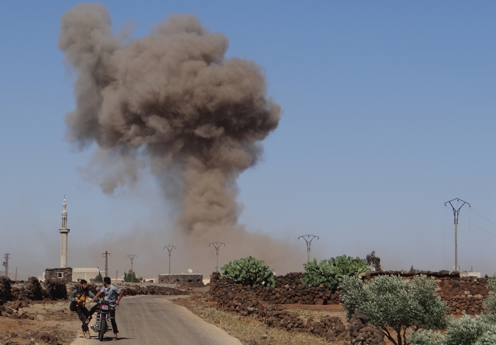 Smoke rises after Assad Regime forces carried out an attack in Syria's southwestern Daraa province on June 23, 2018. Ammar Al Ali - Anadolu
