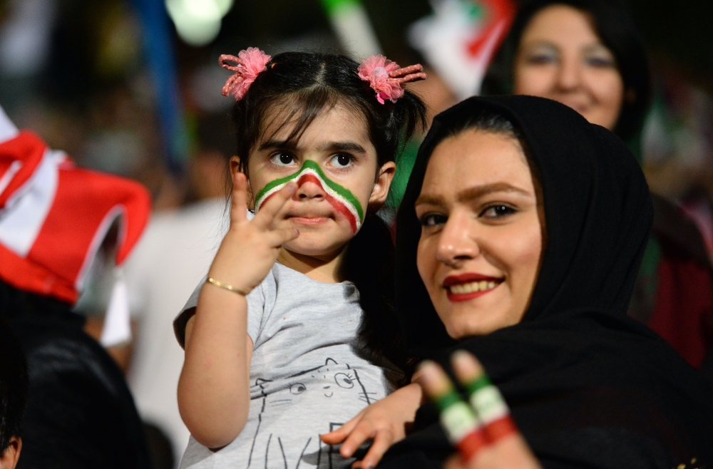 Fans gather for a public viewing event at Azadi Stadium in Tehran, Iran on June 25, 2018, to watch the 2018 FIFA World Cup Russia Group B match between Iran and Portugal. (Fatemeh Bahrami /Anadolu Agency)

