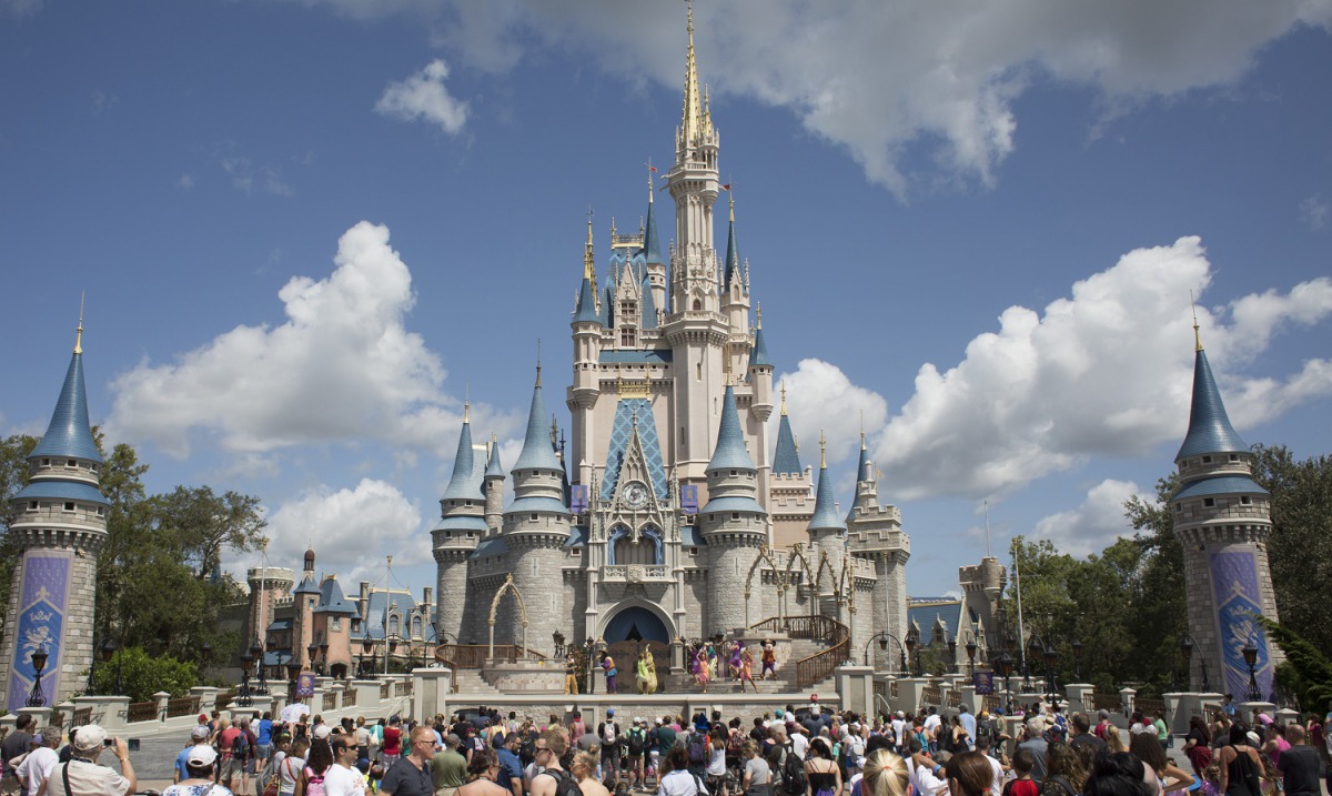 Visitors watch a performance at the Cinderella Castle at the Walt Disney Co. Magic Kingdom park in Orlando, Florida, on Sept. 12, 2017. Bloomberg photo by David Ryder.
