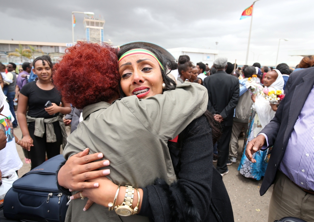 Relatives embrace after meeting at Asmara International Airport, after one arrived aboard the Ethiopian Airlines ET314 flight in Asmara, Eritrea July 18, 2018. Reuters/Tiksa Negeri