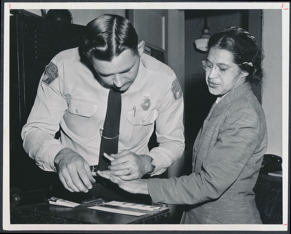 Rosa Parks being fingerprinted by a deputy sheriff  after being arrested for boycotting public transportation, Montgomery, Alabama, February, 1956.