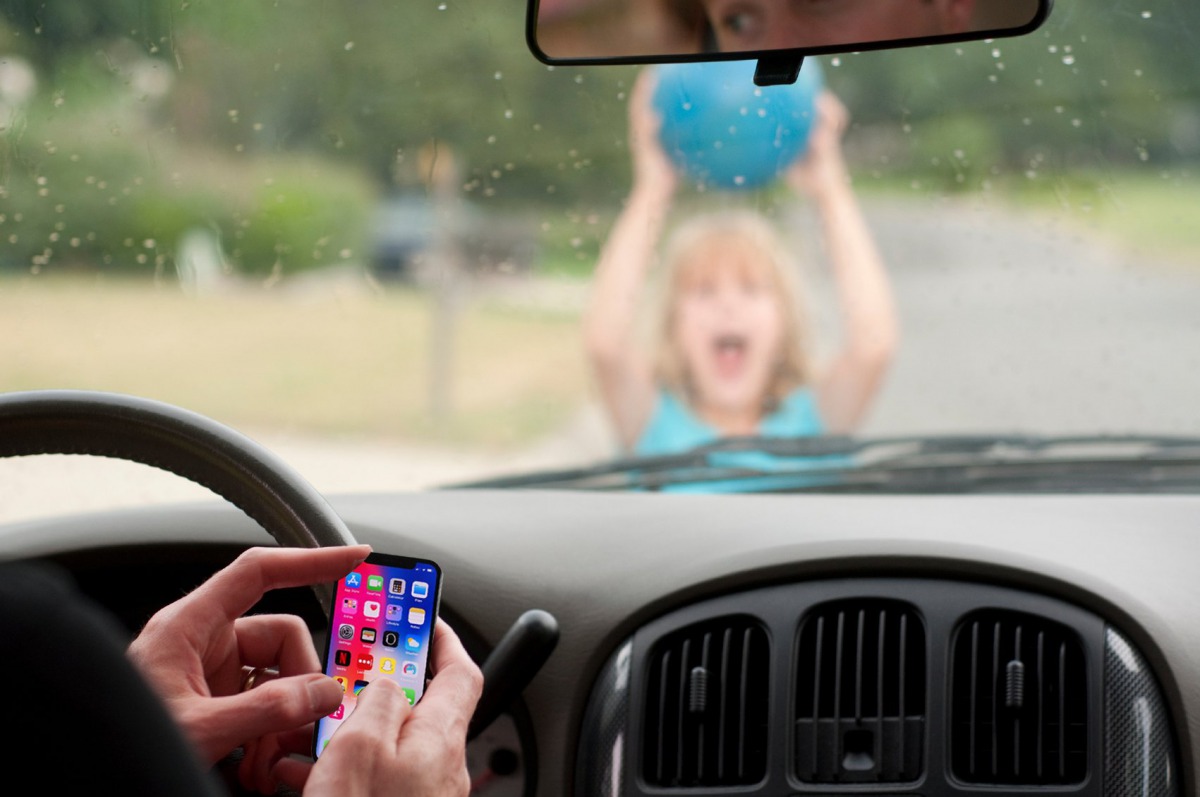 Engaging in the mobile phone while driving may cost you your life, be careful and do not endanger yourself and others.