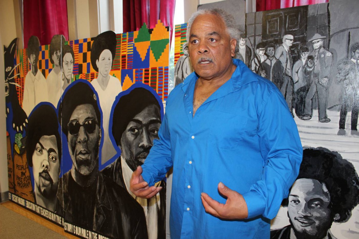 Seattle Black Panthers Party co-founder Elmer Dixon poses for a photograph in front of a commemorative mural, April 27, 2018. Thomson Reuters Foundation/Gregory Scruggs