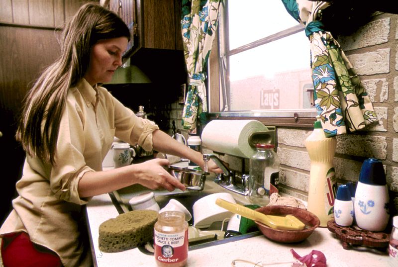 Housewife in the kitchen of her mobile home in one of the trailer parks Photo coutesy: Horacia Villalobos/Environmental Protection Agency's Documerica project in the early 1970s. 