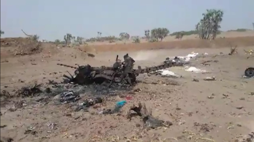 A grab taken from a AFPTV video on August 25, 2018 shows wreckage of a car hit by the strike in Al-Durayhimi, some 20 kilometers south of Hodeida, after a missile strike.(AFP / AFPTV)