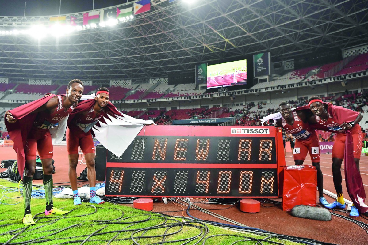 Qatar’s Mohammed Abbas, Abdalelah Haroun, Mohammed Al Noor and Abderrahman Samba celebrate after winning gold medal at the final of the men’s 4x400m relay with a new Asian Record during the 2018 Asian Games in Jakarta yesterday. 