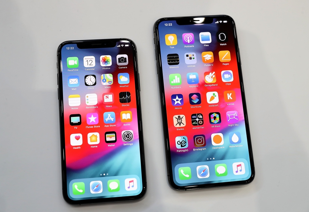 The new Apple iPhone Xs (L) and iPhone Xs Max (R) are displayed during an Apple special event at the Steve Jobs Theatre on September 12, 2018 in Cupertino, California. Justin Sullivan/AFP
