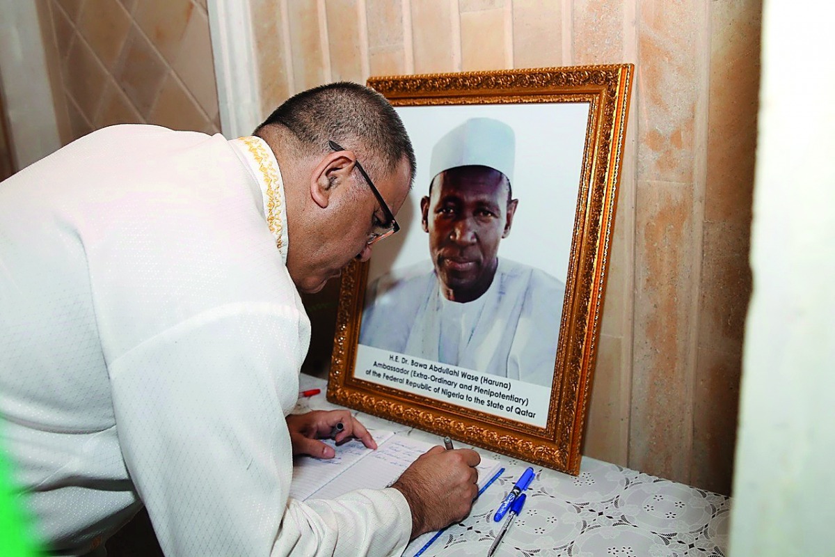 Ambassador of South Africa, Faizel Moosa, signs a condolence book at the residence of the late Ambassador. Pic: Qassim Rahmatullah / The Peninsula