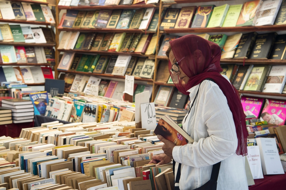 A customer browses books at a bookshop in the Moroccan capital Rabat on August 9, 2018. AFP / FADEL SENNA
 