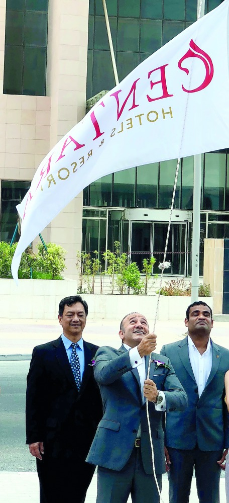 Mario Rabi, General Manager of Centara West Bay Residences & Suites Doha, hoisting the  flag in the presence of Thailand Ambassador to Qatar, Nathapol Khantahiranat (left), at a media event held at the hotel premises yesterday. Pic: Qassim Rahmatullah/ Th