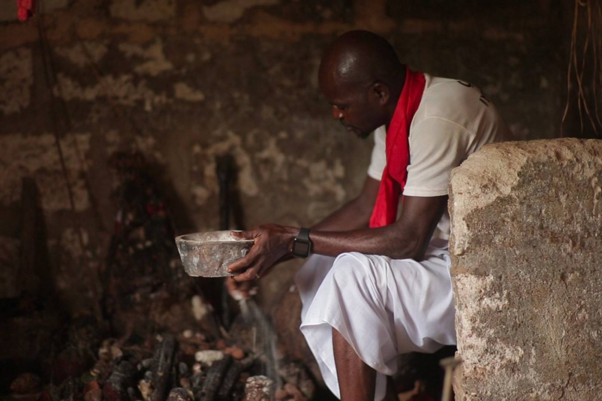 Juju priest David Ubebe performing a ceremony in his shrine, Benin, Nigeria, July 1, 2018. Thomson Reuters Foundation/Kagho Idhebor 