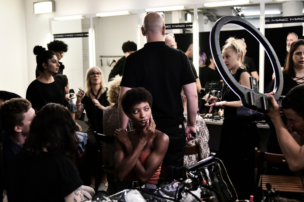 Models wait in the backstage prior to the presentation of Marco De Vincenzo fashion house, during the Women's Spring/Summer 2019 fashion shows in Milan, on September 21, 2018. AFP / Marco Bertorello