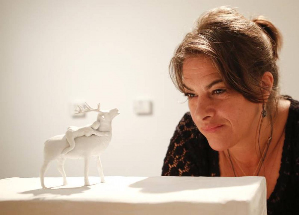 British artist Tracey Emin poses with her artwork 