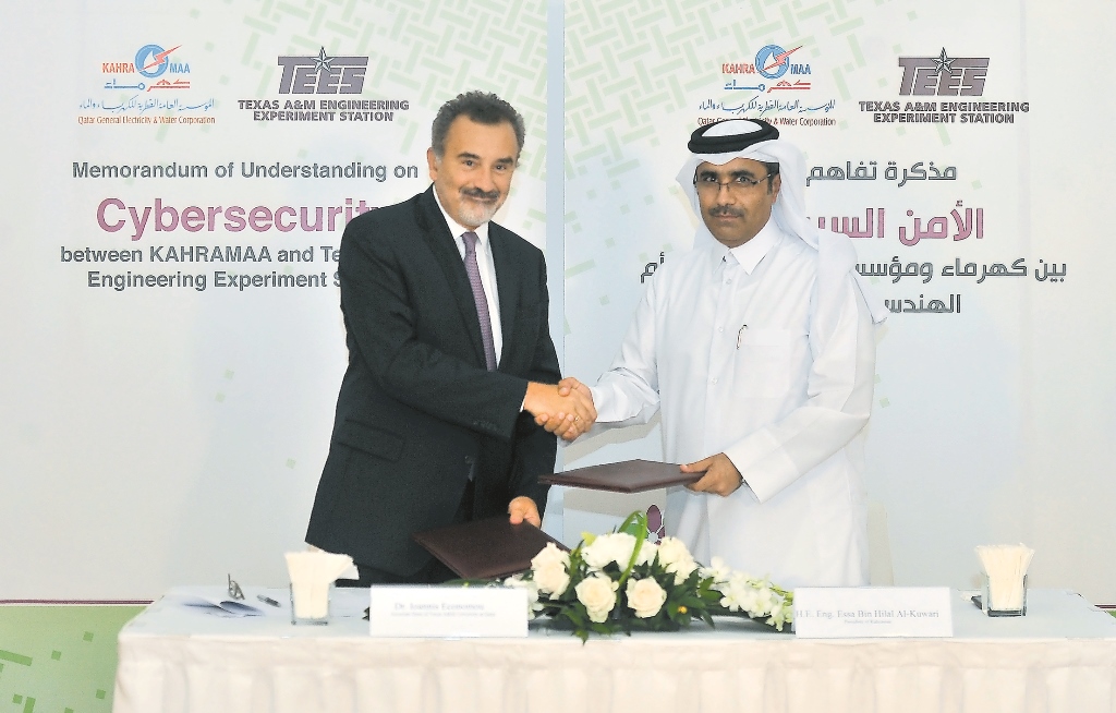 Dr Ioannis G Economou (left), Associate Dean of Texas A&M University at Qatar, and Eng Essa bin Hilal Al Kuwari, President of Kahramaa, during the signing of MoU on cybersecurity at Texas A&M Engineering University yesterday. Pic: Baher Amin / The Peninsu