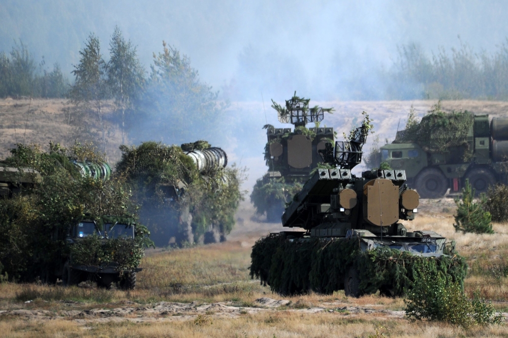 (FILES) In this file photo taken on September 19, 2017 Belarus' OSA-AKM surface-to-air missile launchers and S-300 antiaircraft systems move to firing positions during the joint Russian-Belarusian military exercises Zapad-2017 (West-2017) at a training gr