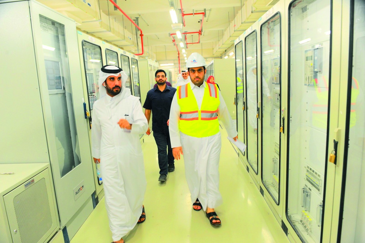 Eng Ahmad Ali Al Kuwari (right), Head of Electricity Projects Section at Kahramaa, with other officials at the substation.