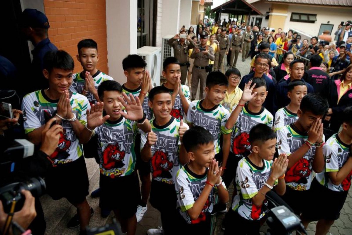 Twelve boys and their soccer coach who were rescued from a flooded cave in Thailand are seen in the northern province of Chiang Rai, July 18, 2018. Three of the boys and their coach were stateless. Reuters/Soe Zeya Tun