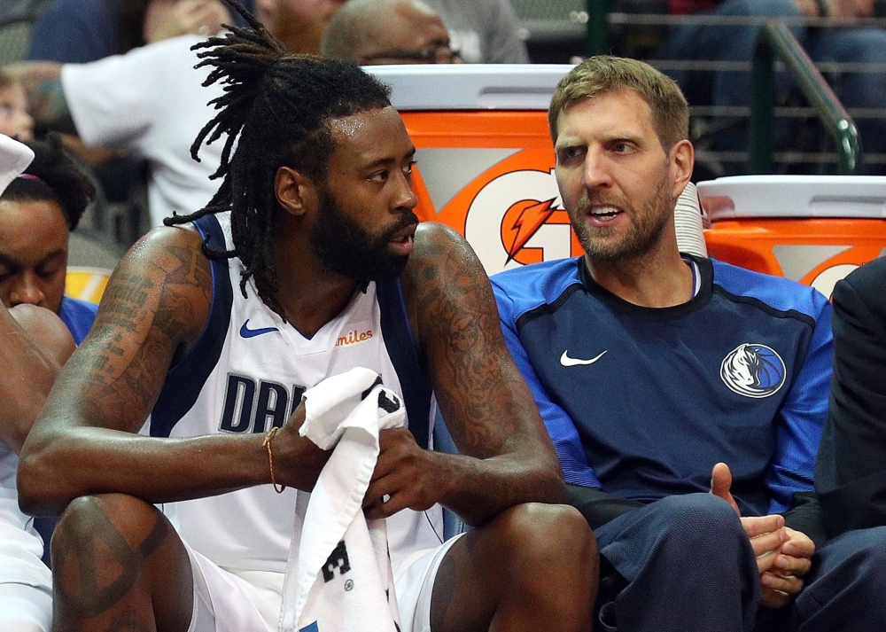 DeAndre Jordan #6 and Dirk Nowitzki #41 of the Dallas Mavericks talk on the bench during a preseason game against the Beijing Ducks at American Airlines Center on September 29, 2018 in Dallas, Texas. Richard Rodriguez/AFP
