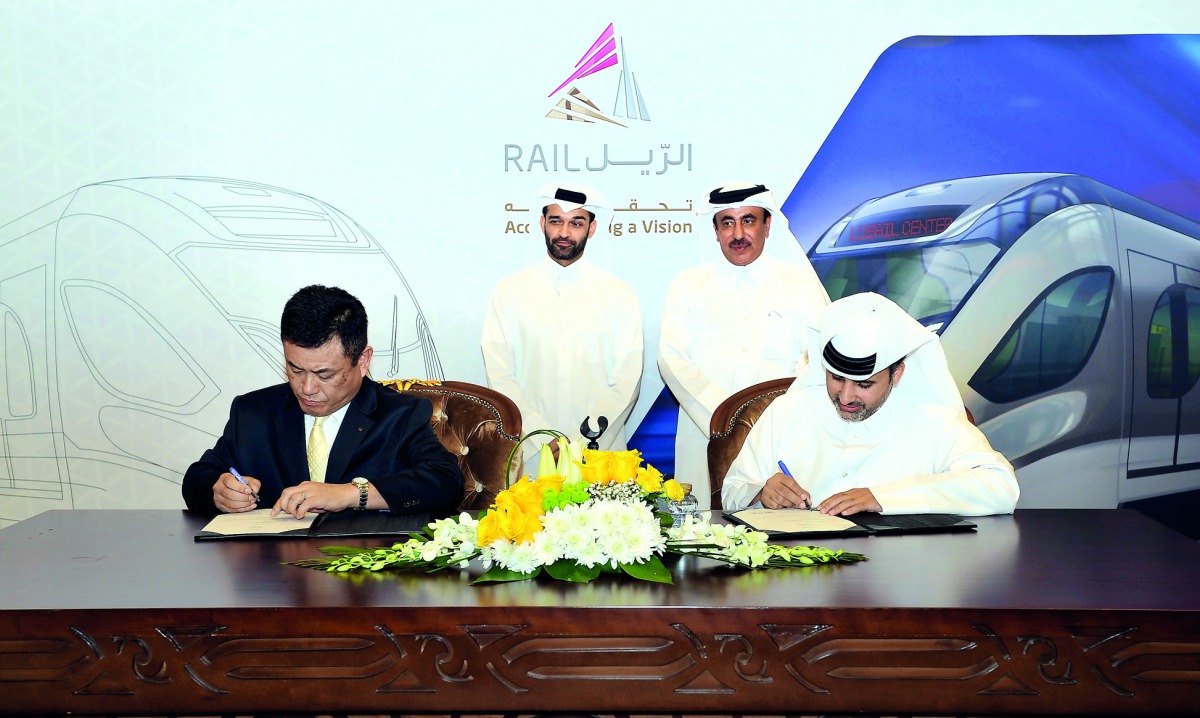 Minister of Transport and Communications and Vice-Chairman of Qatar Rail, H E Jassim bin Saif Al Sulaiti, with Hassan Al Thawadi, Director, Qatar Rail, witnessing a signing ceremony between, Eng Abdulla Abdulaziz Turki Al Subaie, Managing Director and CEO