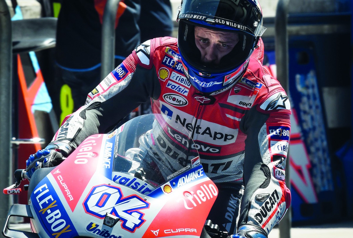 Ducati Team's Italian rider Andrea Dovizioso enters the pit during the free practice session of Thailand's inaugural MotoGP at Buriram International Circuit in Buriram on October 5, 2018. AFP / Lillian Suwanrumpha

