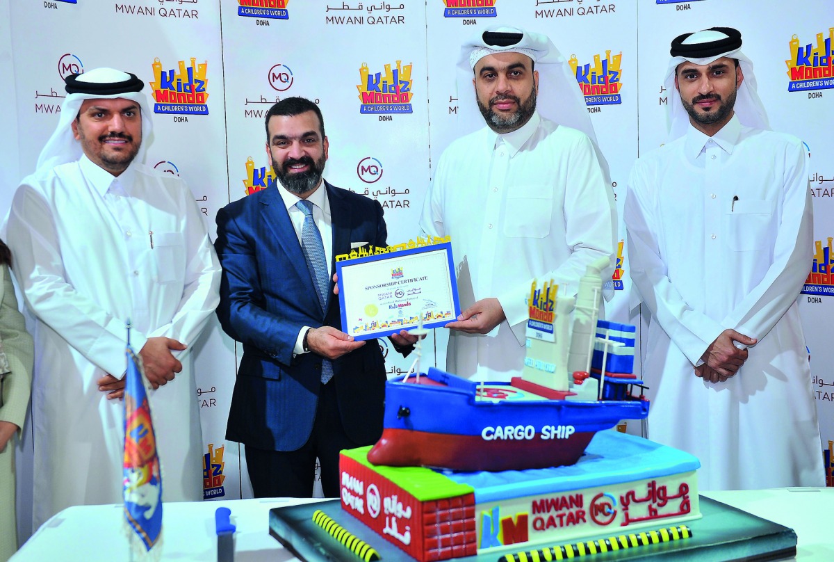 Ali Kazma, CEO of Aura Lifestyle, presenting a certificate to Captain Abdulla Al Khanji, Chief Executive Officer of Mwani Qatar, during the opening of Mwani Qatar establishment at KidzMondo Doha at Mall of Qatar yesterday. Pic: Baher Amin / The Peninsula