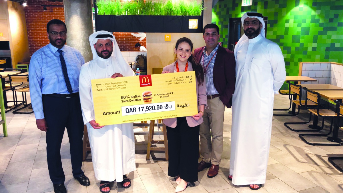 McDonald’s Qatar hands over ‘Big Mac Big Cause’ cheque to Mohammed Mubarak Al Hajri, Head of General Resource Mobilization, Qatar Red Crescent.