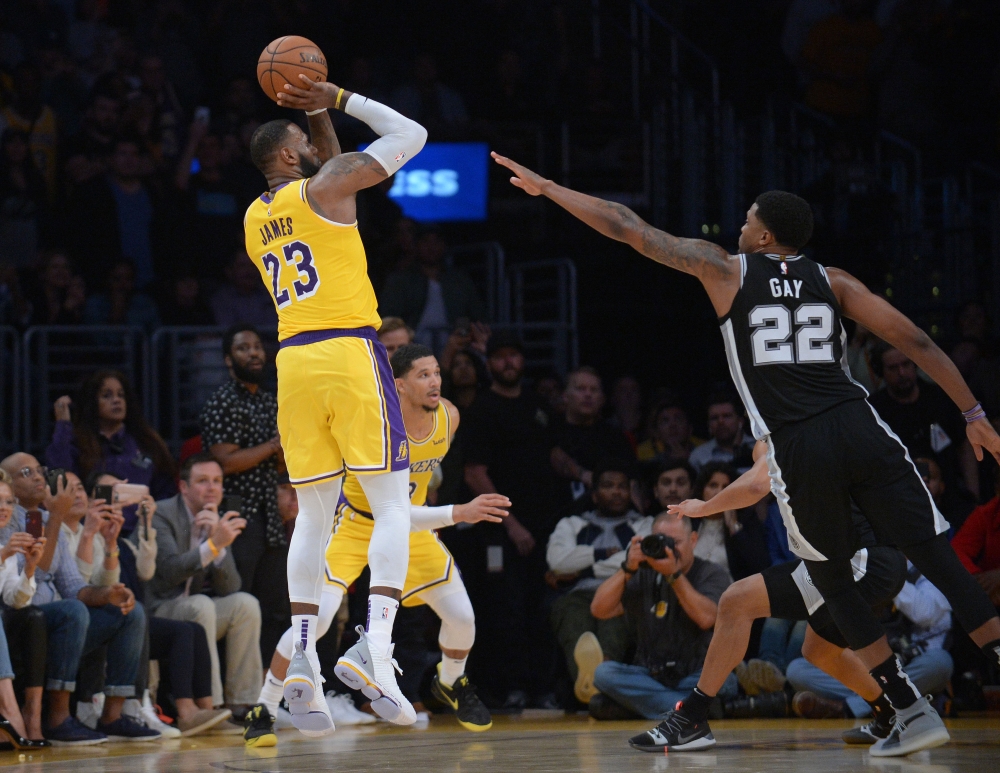 Los Angeles Lakers forward LeBron James (23) shoots against San Antonio Spurs forward Rudy Gay (22) during overtime at Staples Center. Gary A. Vasquez