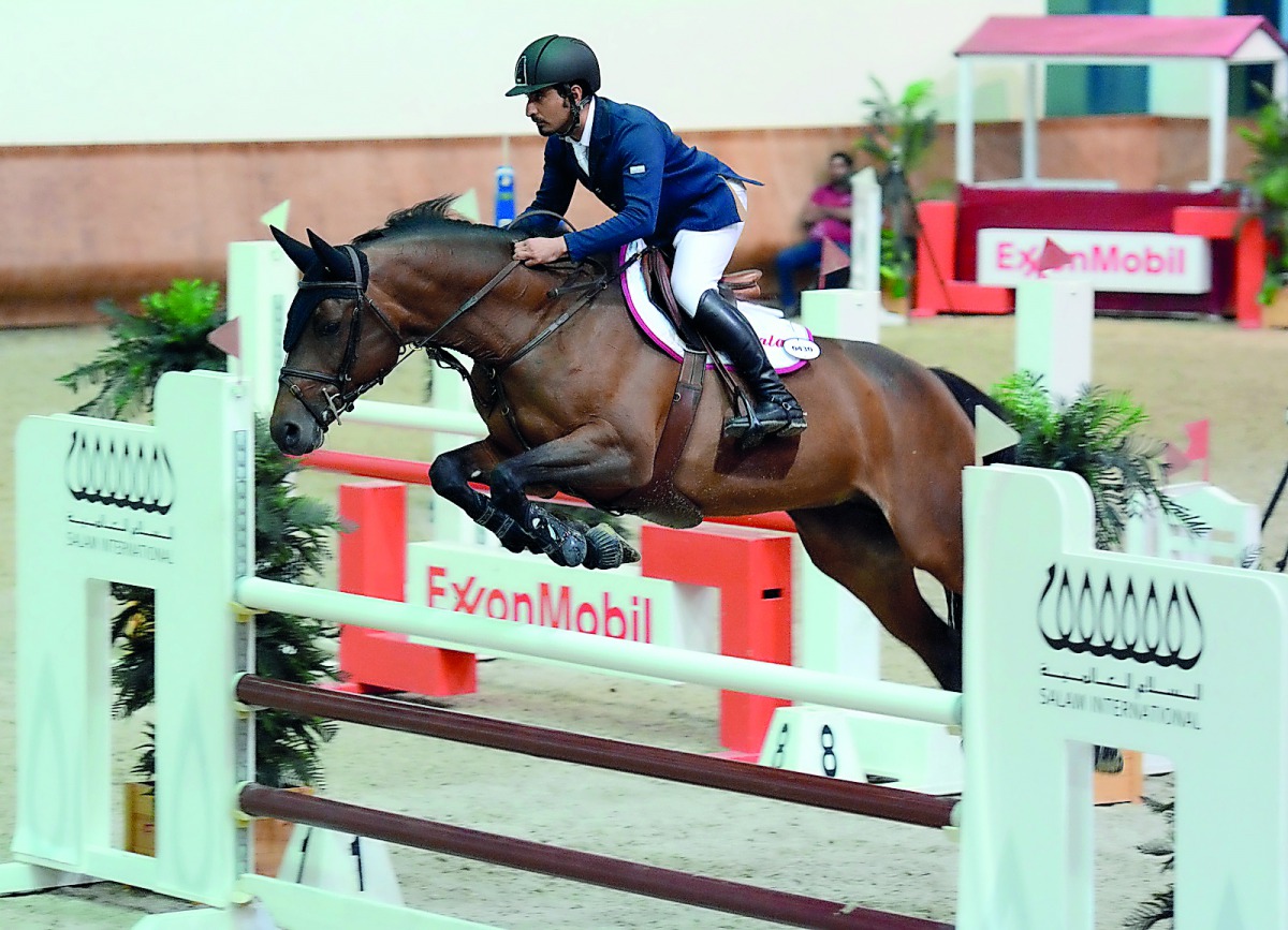 Winner of the Medium Tour, Awad Alqahtani guides Gerenice Of Colors over an obstacle.