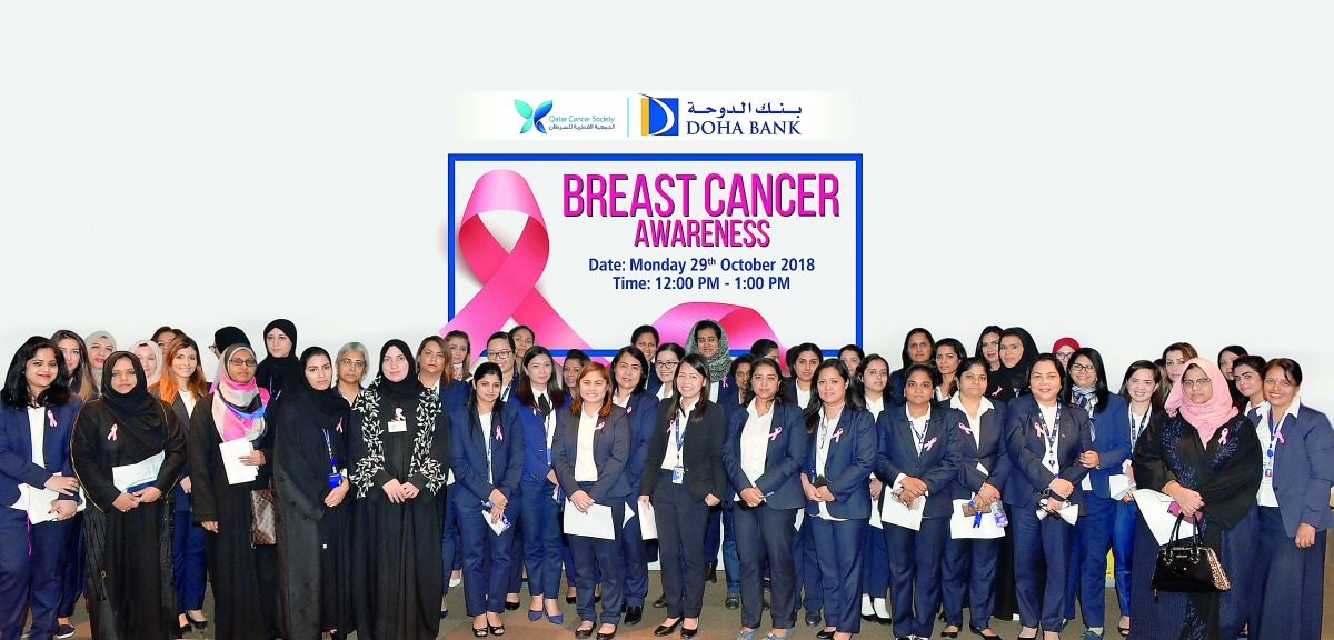 Doha Bank employees and officials at the breast cancer awareness campaign.