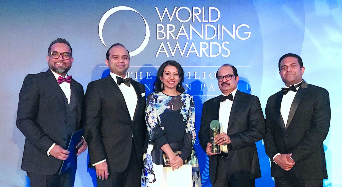 Ashraf Ali MA, Executive Director of Lulu Group; Adeeb Ahamed, MD of Lulu Financial Group; Shafeena Yusuffali, CEO of Tablez; Mohammed Althaf, Director; and V Nandakumar, CCO of Lulu Group, with the Brand of The Year Trophy at the World Branding Awards ce