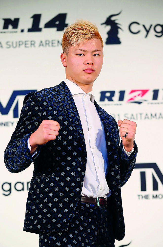 Tenshin Nasukawa posing during a press conference to announce his fight with US Boxing superstar Floyd Mayweather Jr. AFP / Rizin Fighting Federation