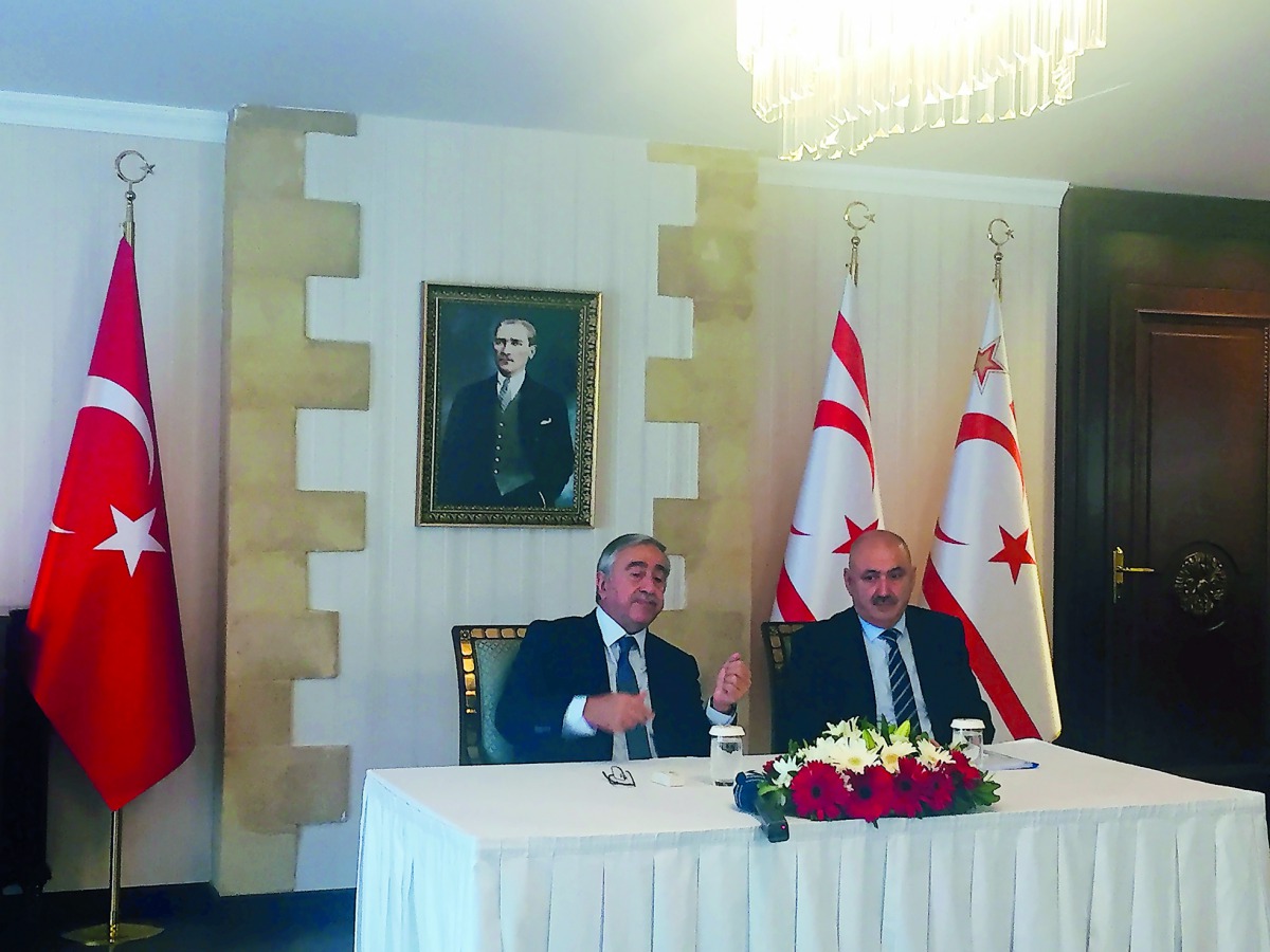 The Turkish Republic of Northern Cyprus President, Mustafa Akinci (left), during a press conference, at the Presidential Palace, in northern Cyprus, yesterday.