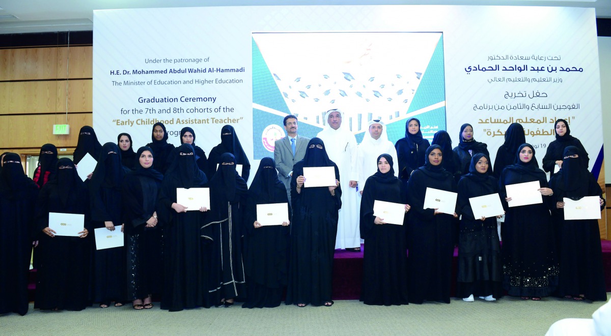 Minister of Education and Higher Education H E Dr Mohammed Abdul Wahed Ali Al Hammadi (sixth right, top row) with the new graduates at a ceremony held yesterday at the headquarters of CCQ.