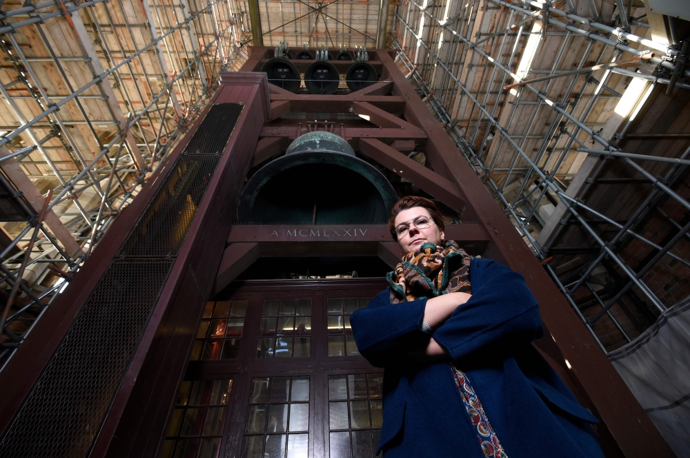 Polish carillon player Malgosia Fiebig poses for a picture below the bells of the Dom Tower (Domtoren) in Utrecht, the Netherlands' tallest church tower, on November 8, 2018. AFP / JOHN THYS