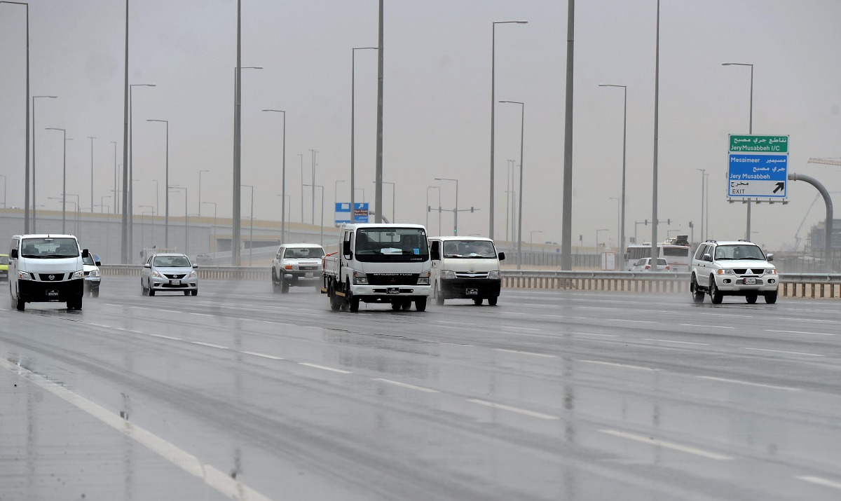 FILE PHOTO: Car moving in Rain at G ring road. Abdul Basit ©  The Peninsula