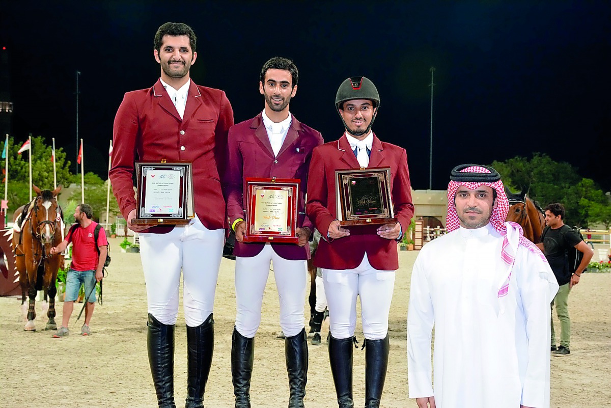 Podium winners of the feature event yesterday, (FROM LEFT) Hamad Ali Al Attiayah, Rashid Towaim Al Marri and Faleh Suwead Al Ajami pose for a photograph after the presentation ceremony.