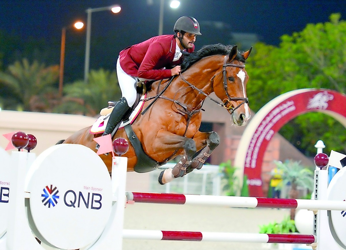 Hamad Ali Al Attiayah, winner of the Grand Prix, guides Clinton  over an obstacle during the third and final day of the QNB Qatar International Show Jumping Championship 2018 at the Qatar Equestrian Federation’s (QEF) outdoor arena yesterday. Pictures: Lo