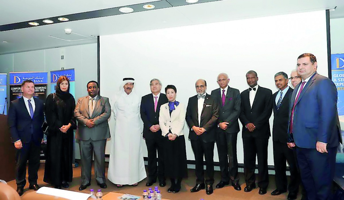 Dignitaries and officials pose for a group picture.